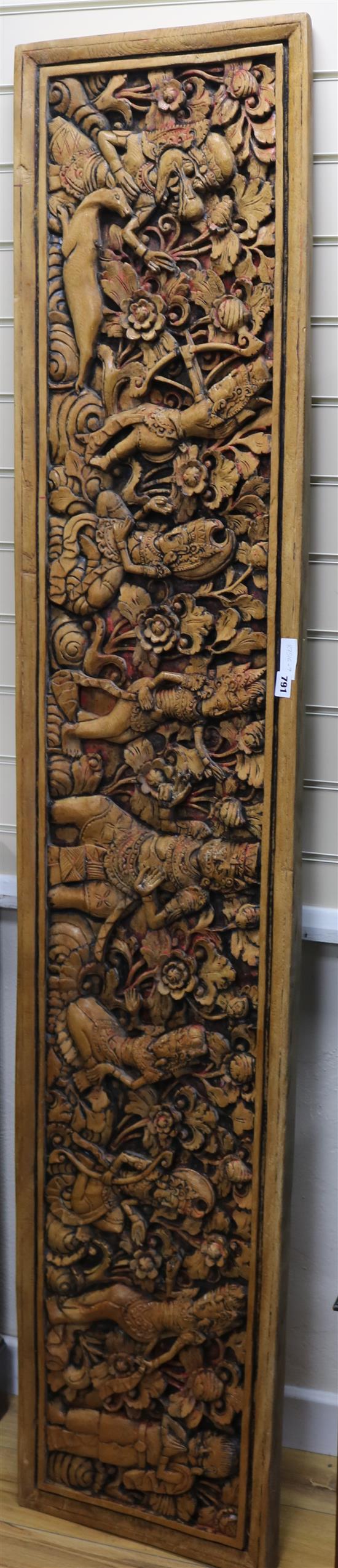 An Indonesian relief carved wood panel